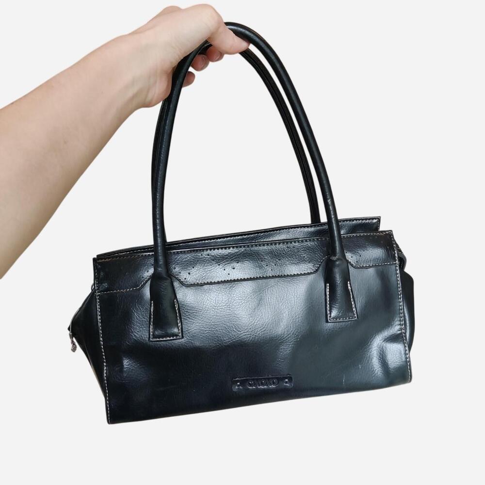 Black XOXO faux leather handbag with a boho vibe